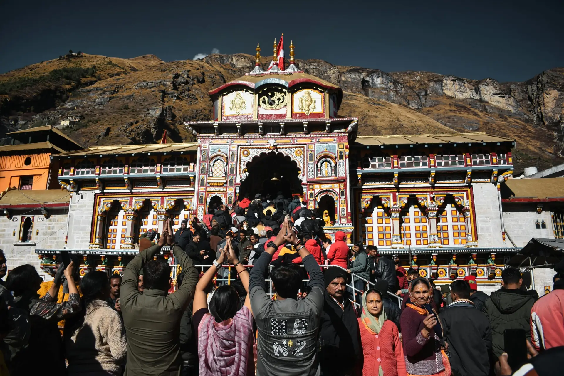 Individuals & Families Crowd of devotees gathered at Badrinath Temple, India, embracing spirituality.